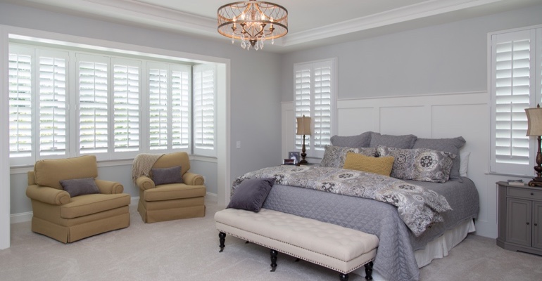Plantation shutters in Southern California bedroom.